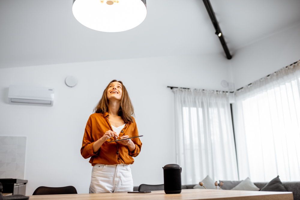 Woman using Zigbee smart home technology 